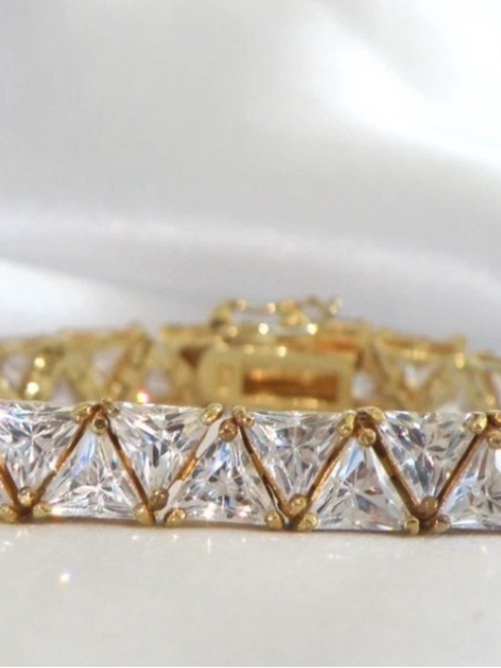 Gold Tennis Bracelet with CZ Triangle stones, with a slide feature and safty